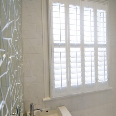 89mm Slat White Full Height Shutters With A Mid Rail Outside Mounted